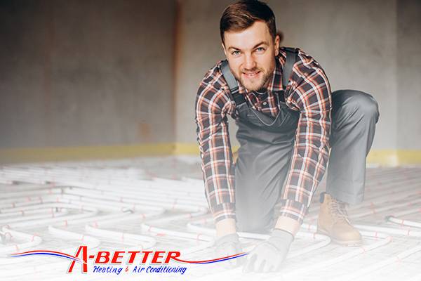 a better heating and air conditioning with technician works on installation