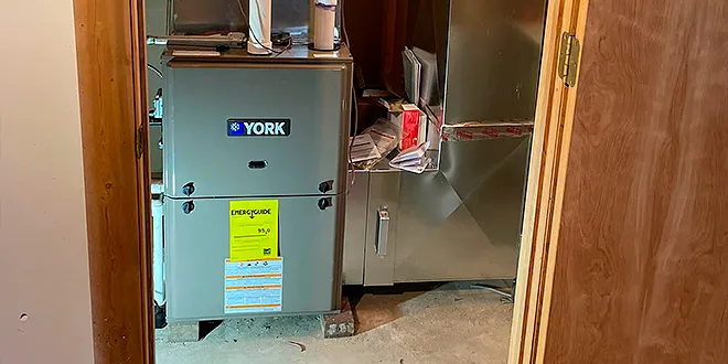 JR Michalski technician performing a seasonal heating maintenance tune-up in Langhorne PA