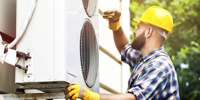 JR Michalski heating technician servicing a furnace in Bucks County PA